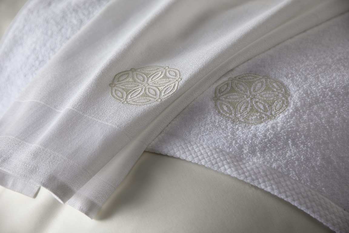 Embroidered white hotel towels