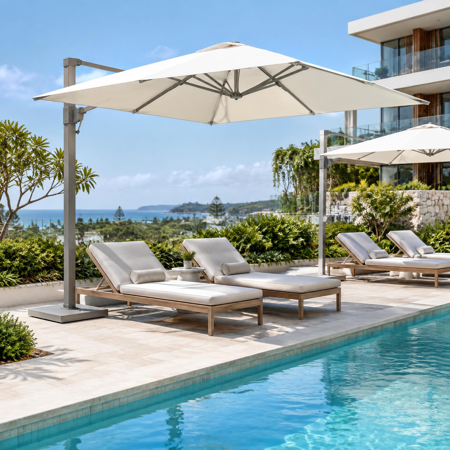 Illustrative commercial umbrellas beside a resort pool